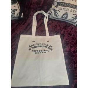 Black and white Ouija board tote bag